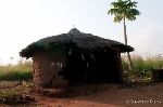 One of the old mud-hut houses that breaks down quickly